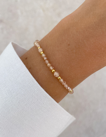 Bransoletka na gumce z cyrkonii szampańskiej z hematytem - ochrona, miłość, dostatek