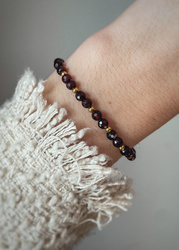 Bracelet on an elastic band with khaki cubic zirconia and natural pearl