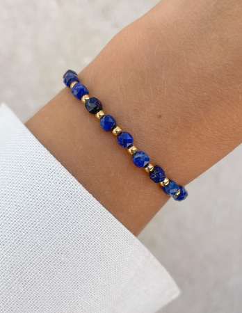 Bransoletka na gumce z lapis lazuli z hematytem - szczęście, dobrobyt, mądrość i odwaga