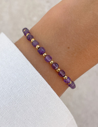 Bracelet on an elastic band with khaki cubic zirconia and natural pearl