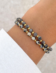 Bracelet on an elastic band with khaki cubic zirconia and natural pearl