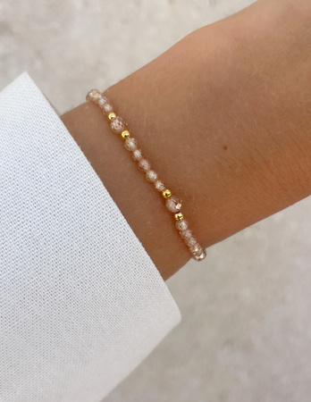 Bransoletka na gumce z cyrkonii szampańskiej z hematytem - ochrona, miłość, dostatek